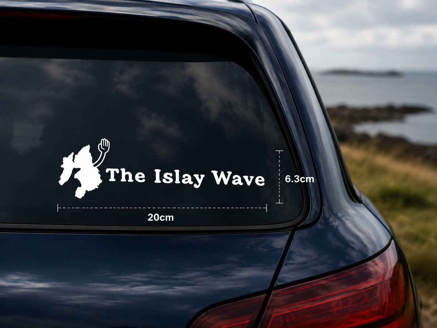 The Islay Wave white vinyl decal on a car, 20cm by 6.3cm